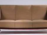 a couch that is sitting on a white surface