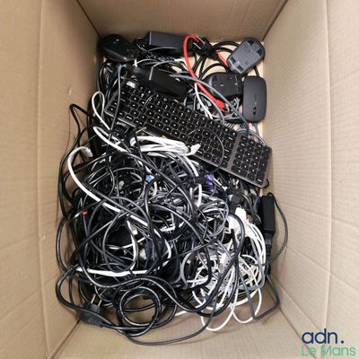 a box full of wires and a keyboard inside of it