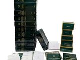 several stacks of books are stacked on top of each other