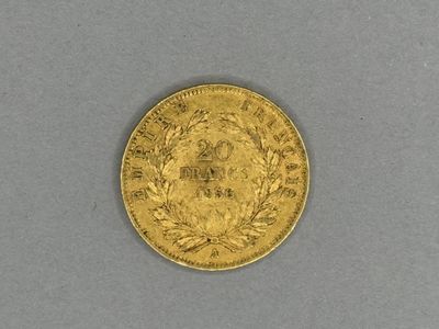 a gold coin on a gray surface