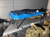 a blue guitar case sitting on a shelf in a room