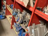 many different types of valves on the shelves in the warehouse