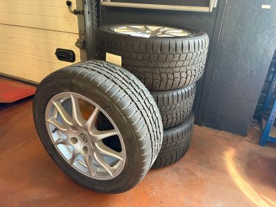 tires stacked on top of each other in a garage