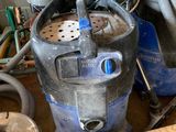 many different types of vacuum cleaners in this room