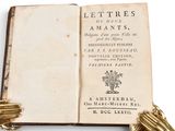 a book with a gold glove on top of it