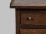 an old wooden table with two drawers and a drawer underneath it