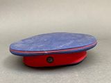 blue and red hat with a button on top of it