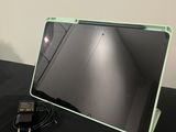 a laptop computer sitting on a table with a mouse on it