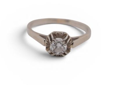a close up of a diamond ring on a white background