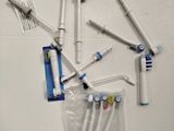 a lot of toothbrushes that are on the table