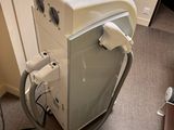 an image of a room with a washing machine and other appliances