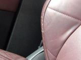 a close up of a leather seat in a car
