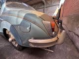 an old car that is parked in a garage