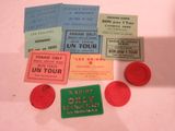 many different colored tickets on a white table