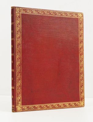 un vieux livre rouge aux tranches dorées et à la bordure dorée