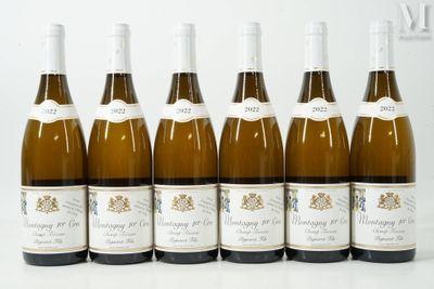 six bottles of wine are lined up in a row on a table