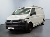 the white van is parked in a room with a black floor