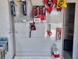 many tools hanging on a pegboard in a garage