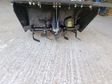 an image of a snow plow attachment on the ground