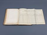 an open book on a table with a blue background