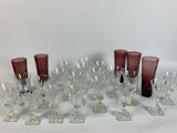 a lot of wine glasses sitting on a table
