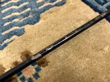 a close up view of a long stick on a rug