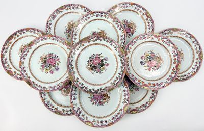 a lot of plates that are sitting on a table