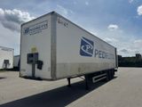 a delivery truck that is parked in a parking lot