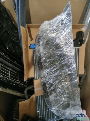 a cardboard box with a bunch of tires in it