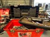 a red box with tools in it in a garage