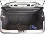 a trunk of a car with a bunch of electronics in it