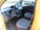 a small yellow car with a steering wheel and a dashboard