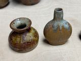 three vases that are sitting on a table