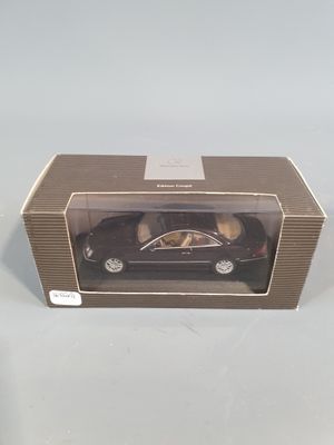 the toy car is in the box on the table