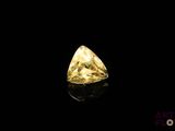 a yellow diamond on a black background
