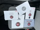 a lot of papers that are sitting on the seat of a car
