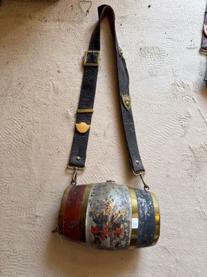 a purse hanging on a wall with a strap