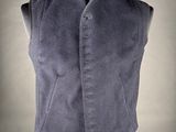an image of a man ' s vest and tie on a mannequin