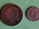 two coins, one of which is a head and one of which is a face