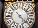 a large clock that has roman numerals on it
