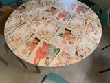 a table that has a bunch of comics on it