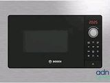 four à micro-ondes en acier inoxydable avec commandes électroniques et affichage numérique