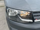 a close up of a car ' s headlight and front bumper