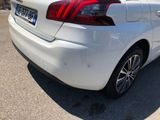 a white car that is parked in a parking lot