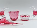 four pieces of glass that are sitting on a table