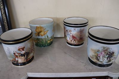 four cups that are sitting on a table