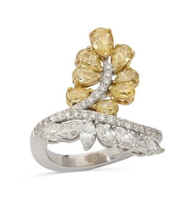 a yellow and white diamond flower ring