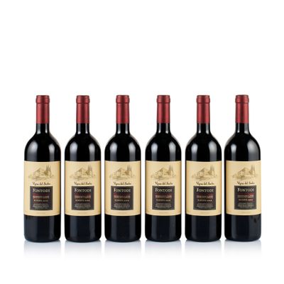 six bottles of red wine lined up in a row