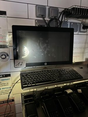 a laptop computer sitting on top of a desk