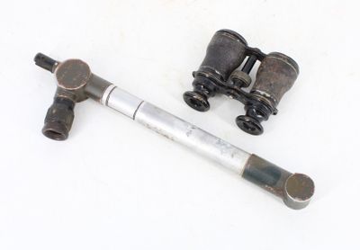 an old pair of binoculars on a white surface